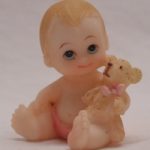 miniatures girl holding bear